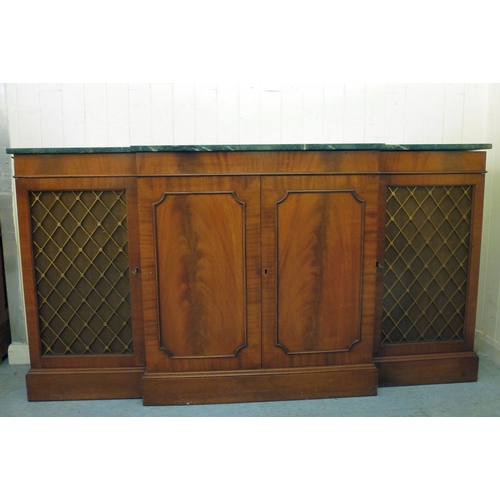107 - A modern Reprodux mahogany breakfront chiffonier, the marble top over four doors, raised on a plinth... 