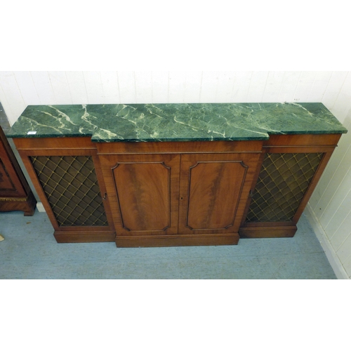 107 - A modern Reprodux mahogany breakfront chiffonier, the marble top over four doors, raised on a plinth... 