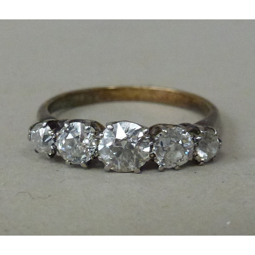 10 - WITHDRAWN  A white metal five stone diamond ring