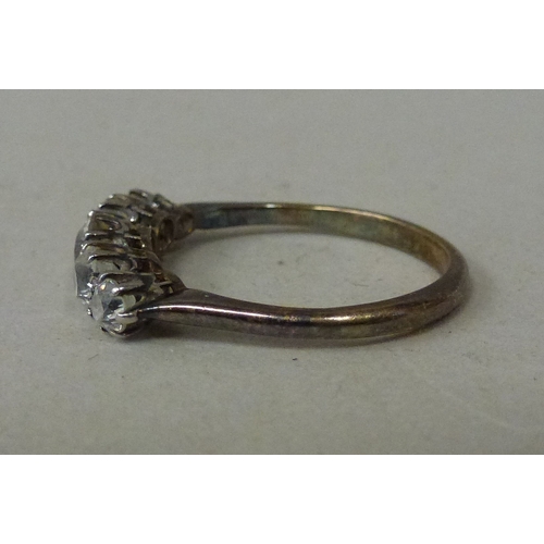 10 - WITHDRAWN  A white metal five stone diamond ring