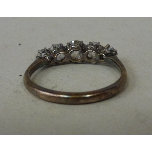 10 - WITHDRAWN  A white metal five stone diamond ring