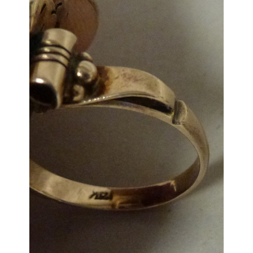 12 - A 14ct gold ring, set with an amethyst coloured stone&nbsp; (approx. 7.6grms)