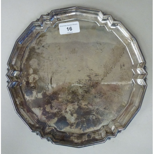 16 - A silver salver with a cast border and pad feet&nbsp; Birmingham 1955&nbsp; 10
