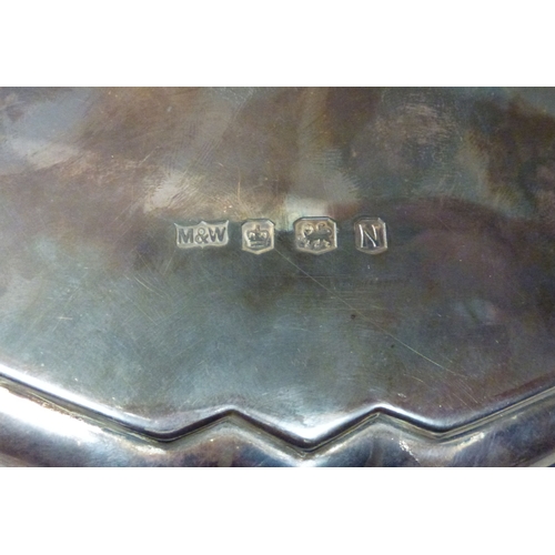 16 - A silver salver with a cast border and pad feet&nbsp; Birmingham 1955&nbsp; 10