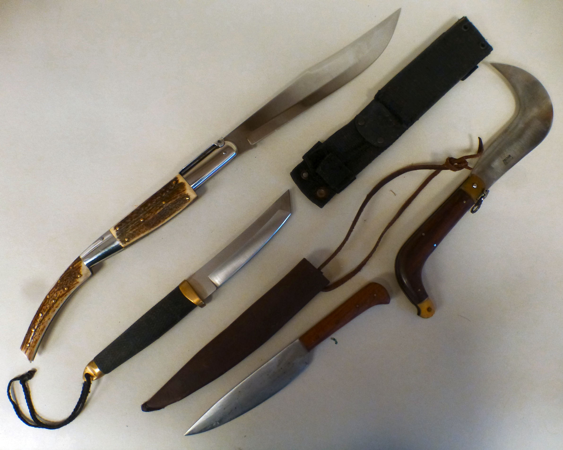 Edged weapons: to include a dagger with a wire wrapped handle, the ...