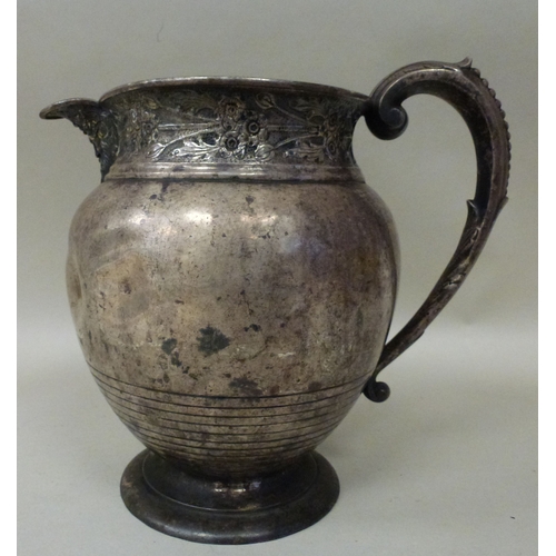 21 - WITHDRAWN A white metal jug of sparrow beak design  7.5