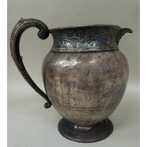 21 - WITHDRAWN A white metal jug of sparrow beak design  7.5