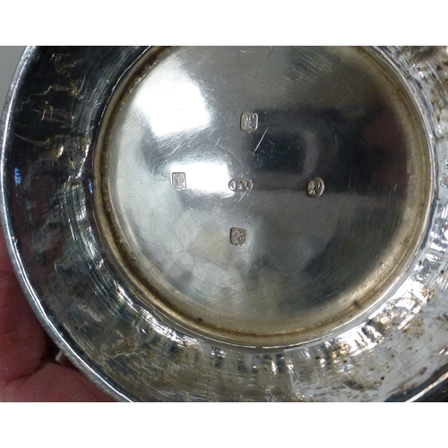 3 - A mid Victorian silver three piece tea set, comprising a teapot, sugar basin and milk jug with scrol... 