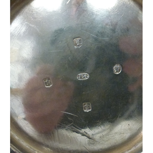 3 - A mid Victorian silver three piece tea set, comprising a teapot, sugar basin and milk jug with scrol... 