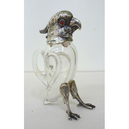 30 - A late Victorian whisky decanter, fashioned as a parrot with a silver collar, head and legs  Henry W... 