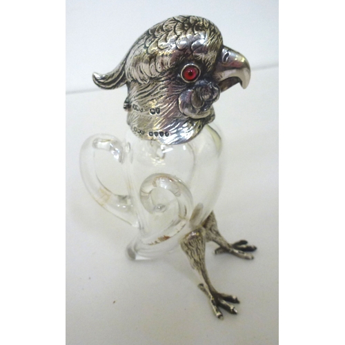 30 - A late Victorian whisky decanter, fashioned as a parrot with a silver collar, head and legs  Henry W... 