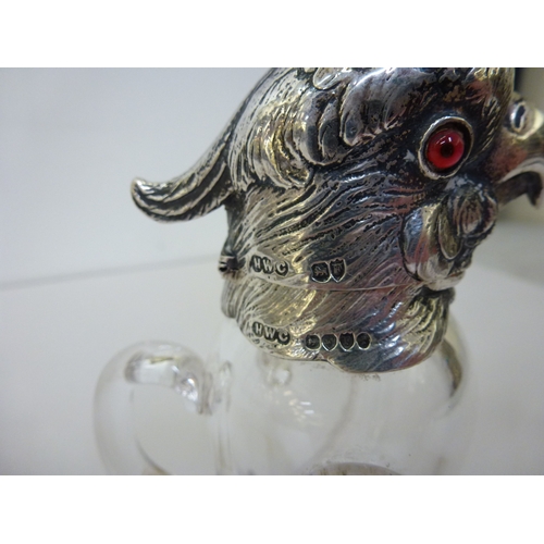 30 - A late Victorian whisky decanter, fashioned as a parrot with a silver collar, head and legs  Henry W... 