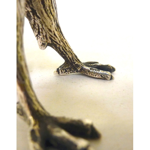 30 - A late Victorian whisky decanter, fashioned as a parrot with a silver collar, head and legs  Henry W... 