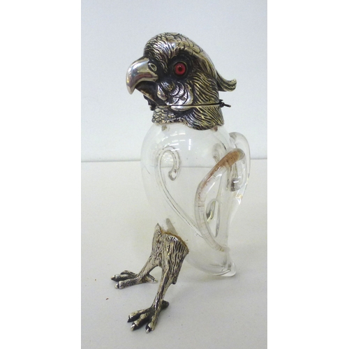 30 - A late Victorian whisky decanter, fashioned as a parrot with a silver collar, head and legs  Henry W... 