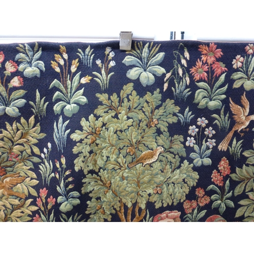 55 - HAL - a 20thC Flemish inspired tapestry hanging, depicting figures in period costume, in a woodland ... 