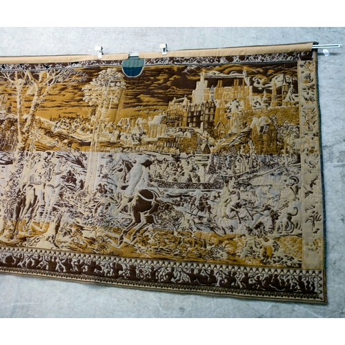 57 - A 20thC Flemish inspired tapestry hanging, depicting an inner city landscape from a woodland hillsid... 
