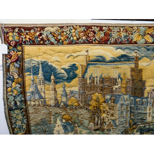 57 - A 20thC Flemish inspired tapestry hanging, depicting an inner city landscape from a woodland hillsid... 