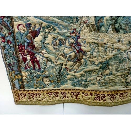 57 - A 20thC Flemish inspired tapestry hanging, depicting an inner city landscape from a woodland hillsid... 