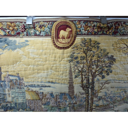 57 - A 20thC Flemish inspired tapestry hanging, depicting an inner city landscape from a woodland hillsid... 