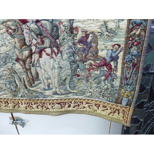57 - A 20thC Flemish inspired tapestry hanging, depicting an inner city landscape from a woodland hillsid... 