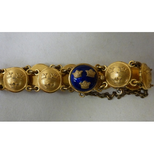 8 - A Sporrong & Co Swedish gilt metal and blue enamelled brooch; and matching bracelet
