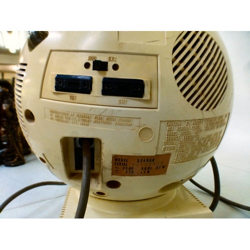 A JVC Videosphere television on stand