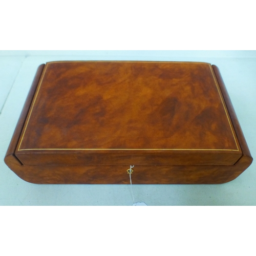 A modern Made in Italy mottled tan coloured hide jewellery box with a ...