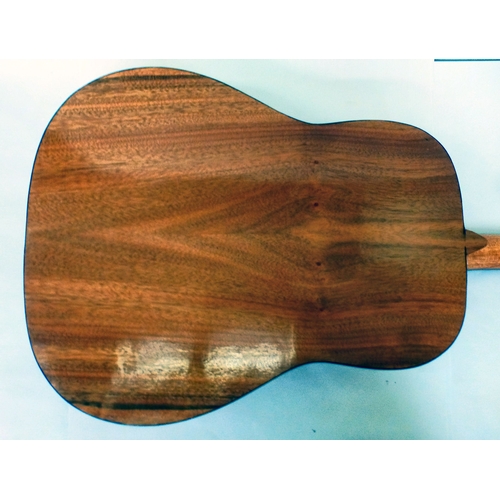 A six string acoustic guitar