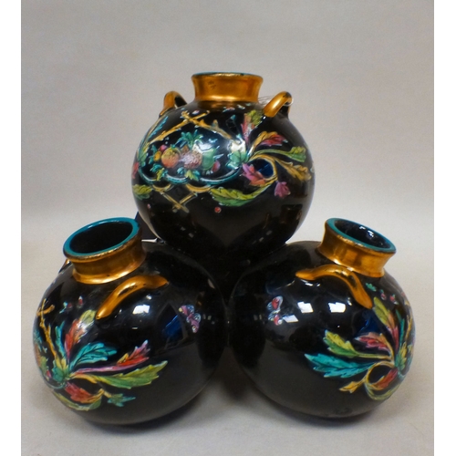 19 - A late Victorian glass centrepiece comprising four stacked, twin handled vases with gilding and flor... 