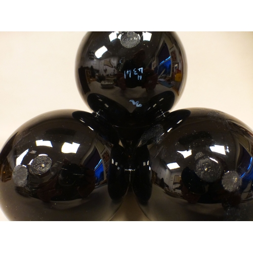 19 - A late Victorian glass centrepiece comprising four stacked, twin handled vases with gilding and flor... 