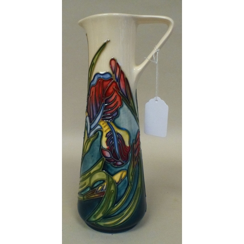 27 - A Moorcroft pottery Iris pattern jug  bears printed marks  dated '96  9.5