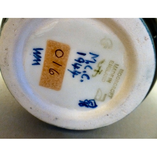 27 - A Moorcroft pottery Iris pattern jug  bears printed marks  dated '96  9.5