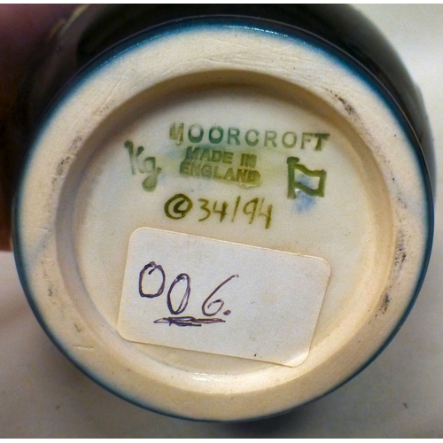 28 - A Moorcroft pottery Anemone pattern vase  bears printed marks  numbered 34/95  6