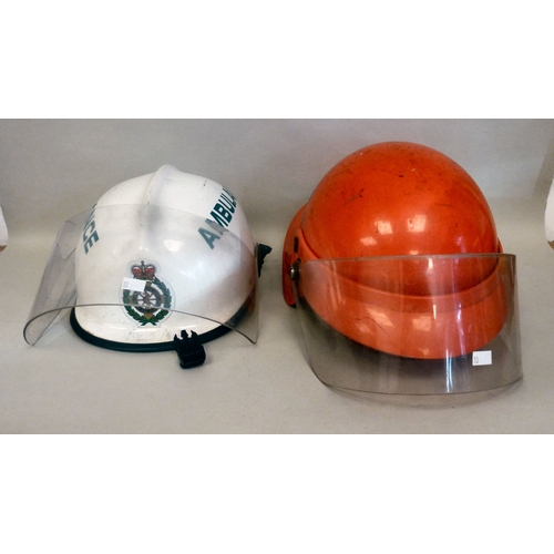 33 - Six Emergency services helmets: to include UK and American examples(Please Note: this lot is subject... 