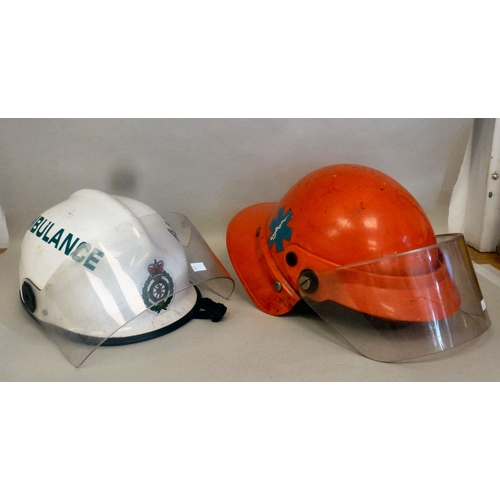 33 - Six Emergency services helmets: to include UK and American examples(Please Note: this lot is subject... 