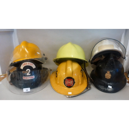 34 - Six Emergency services helmets: to include UK and American examples(Please Note: this lot is subject... 