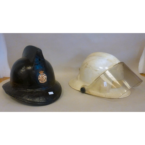 34 - Six Emergency services helmets: to include UK and American examples(Please Note: this lot is subject... 