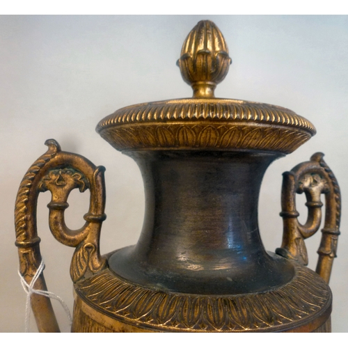 37 - A pair of late 19thC Empire design cast metal, urn design vases/candlesticks, on a plinth  14.5