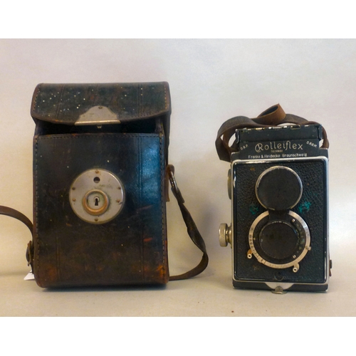 39 - A Rolleiflex camera, in a stitched hide case
