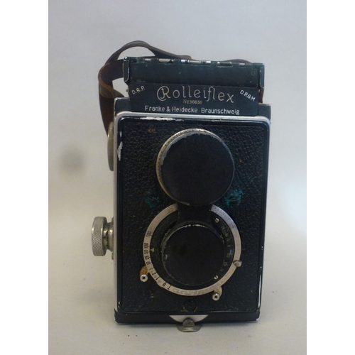 39 - A Rolleiflex camera, in a stitched hide case