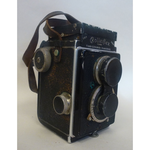 39 - A Rolleiflex camera, in a stitched hide case