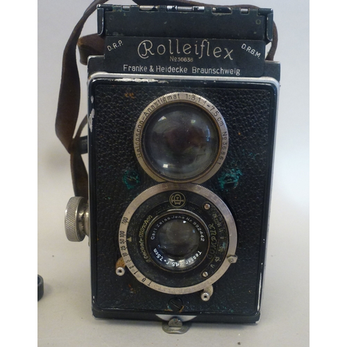 39 - A Rolleiflex camera, in a stitched hide case