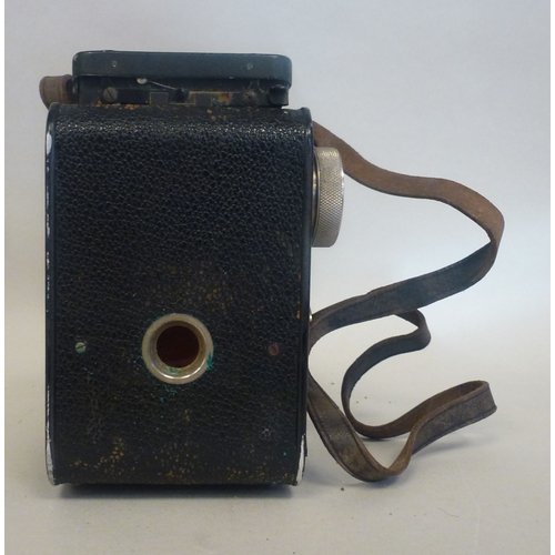 39 - A Rolleiflex camera, in a stitched hide case