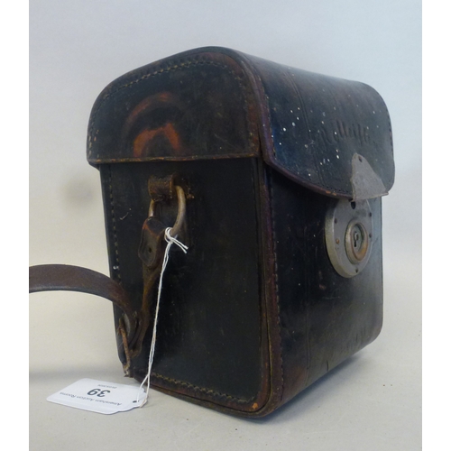 39 - A Rolleiflex camera, in a stitched hide case