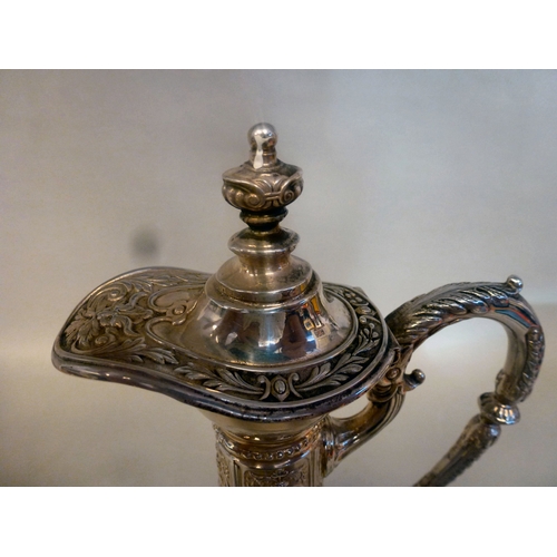 44 - A mid 20thC glass and silver plated claret jug, embossed with cherubs and swags&nbsp; 14