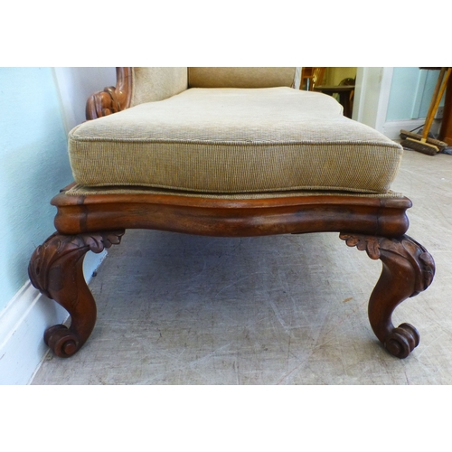 5 - A pair of mid Victorian mahogany showwood framed chaise longue, upholstered in oatmeal coloured fabr... 