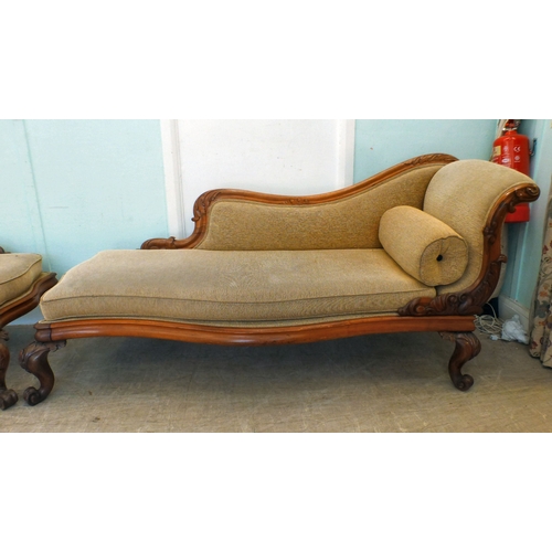 5 - A pair of mid Victorian mahogany showwood framed chaise longue, upholstered in oatmeal coloured fabr... 