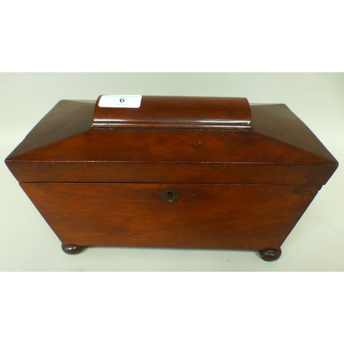 6 - A late Regency mahogany tea caddy of sarcophagus form, the hinged lid enclosing two lidded compartme... 