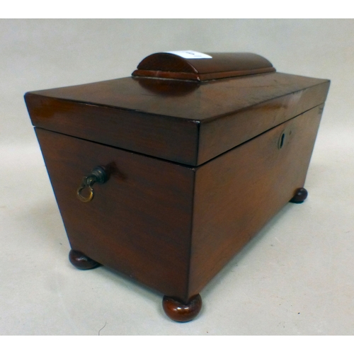 6 - A late Regency mahogany tea caddy of sarcophagus form, the hinged lid enclosing two lidded compartme... 