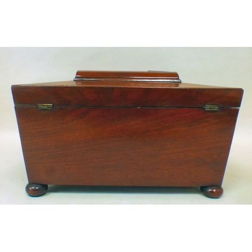 6 - A late Regency mahogany tea caddy of sarcophagus form, the hinged lid enclosing two lidded compartme... 